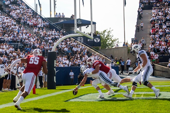 (Chris Detrick  |  The Salt Lake Tribune)  Brigham Young Cougars quarterback Beau Hoge (7) remains on the ground after being tackled for a safety by Wisconsin Badgers linebacker Tyler Johnson (59) during the game at LaVell Edwards Stadium Saturday Saturday, September 16, 2017. Wisconsin Badgers defeated Brigham Young Cougars 40-6.