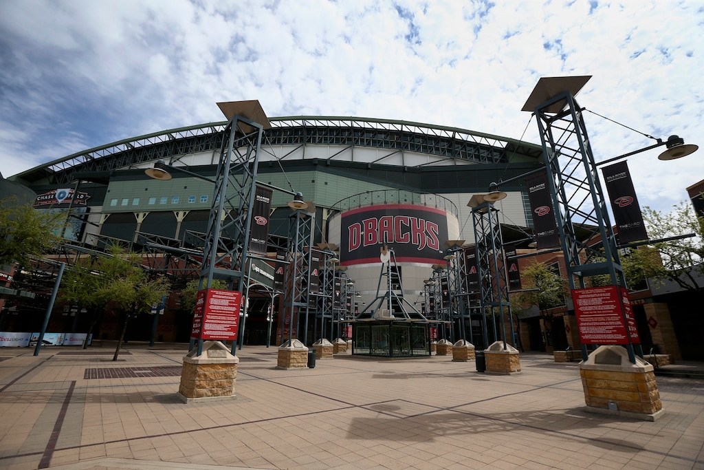 (Ross D. Franklin | AP file photo) The main entrance in front of Chase Field is devoid of activity in Phoenix, Thursday, March 26, 2020. Putting all 30 teams in the Phoenix area this season and playing in empty ballparks was among the ideas discussed Monday, April 6, 2020 during a call among five top officials from MLB and the players' association that was led by Commissioner Rob Manfred, people familiar with the discussion told The Associated Press.