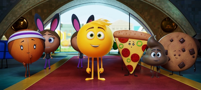This image released by Sony Pictures shows Gene, voiced by T.J. Miller, center, in Columbia Pictures and Sony Pictures Animation's "The Emoji Movie." (Sony Pictures Animation via AP)
