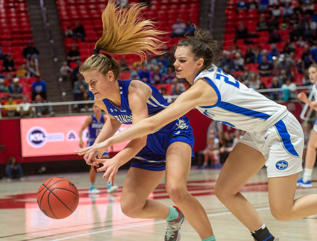 (Rick Egan  |  The Salt Lake Tribune)   Fremont Sliverwolves Averee Porter (23)  goes for a loose ball along with Bingham Miners Sierra Lichtie (20) in the 6A championship game, between the Fremont Sliverwolves and the Bingham Miners, at the Jon M. Huntsman Center, Saturday Feb. 29, 2020
