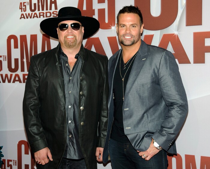 FILE - In this Nov. 9, 2011 file photo, Eddie Montgomery, left, and Troy Gentry of Montgomery Gentry arrive at the 45th Annual CMA Awards in Nashville, Tenn. Gentry, one half of the award-winning country music duo Montgomery Gentry, died Friday, Sept. 8, 2017, in a helicopter crash, according to a statement from the band’s website. He was 50. The group was supposed to perform Friday at the Flying W Airport & Resort in Medford, N.J. (AP Photo/Evan Agostini, File)