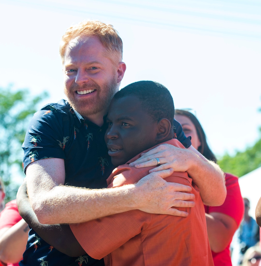 (Rick Egan | The Salt Lake Tribune) Jesse Tyler Ferguson hugs Ashraf Barobi while filming an episode of the TV show "Extreme Makeover: Home Edition" in Ogden, Thursday, Aug. 15, 2019.