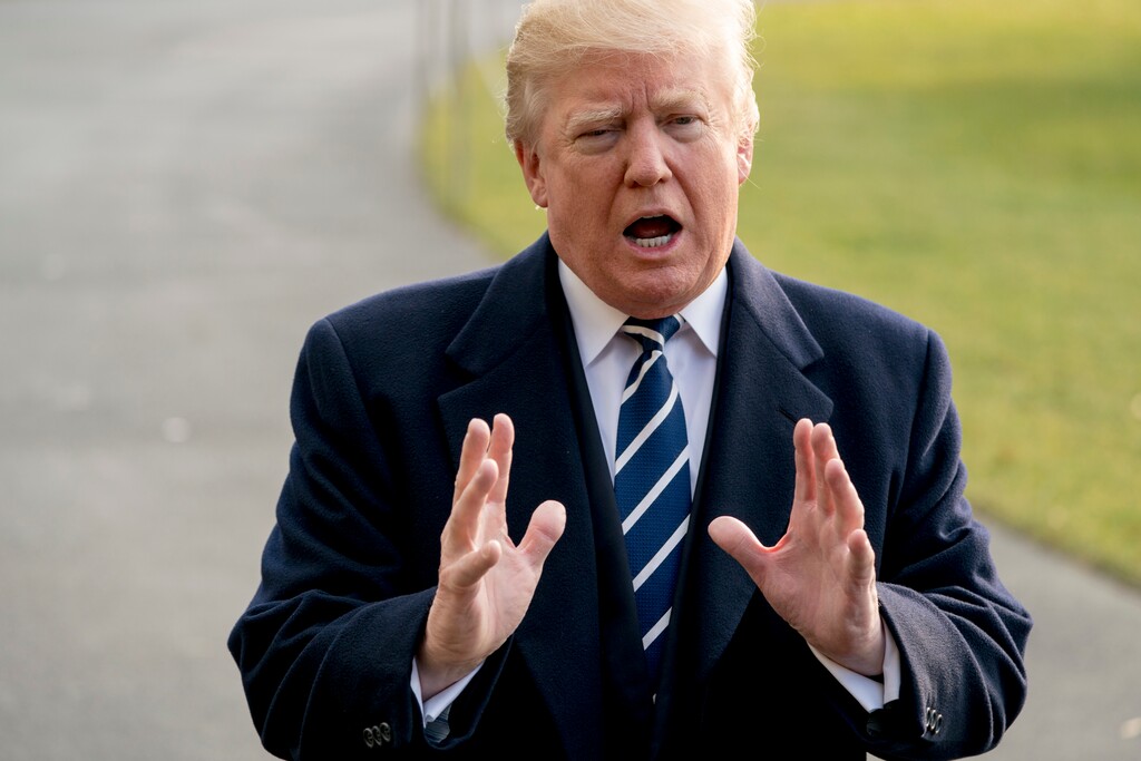 (AP Photo/Andrew Harnik) President Donald Trump speaks to members of the media before boarding Marine One at the White House, Saturday, Dec. 2, 2017, in Washington. Trump is traveling to New York for a fundraising event.
