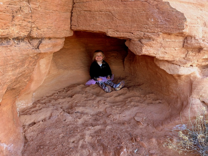 Erin Alberty  |  The Salt Lake TribuneA young hiker finds a hiding spot just below the plateau on Lower Aztec Butte in Canyonlands National Park.