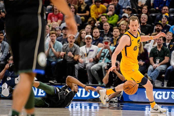 (Trent Nelson | The Salt Lake Tribune)  Utah Jazz forward Joe Ingles (2) runs down a loose ball ahead of a diving Milwaukee Bucks forward Giannis Antetokounmpo (34) as the Utah Jazz host the Milwaukee Bucks, NBA basketball in Salt Lake City Saturday November 25, 2017.