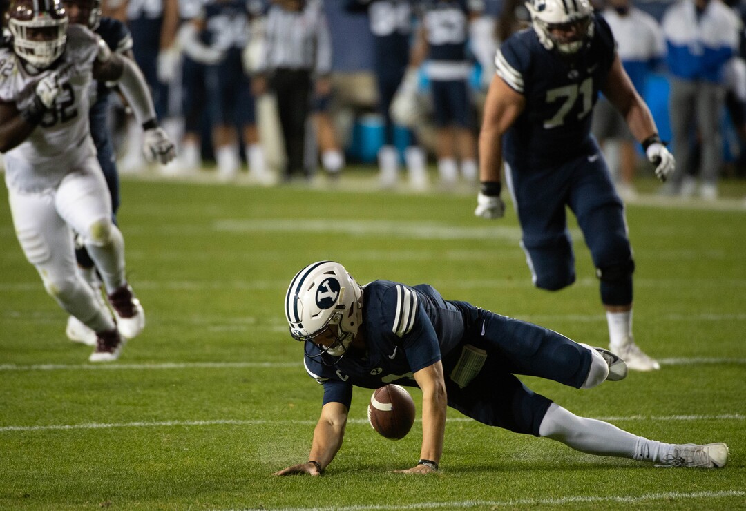 (Francisco Kjolseth  |  The Salt Lake Tribune) Brigham Young Cougars quarterback Zach Wilson (1) fumbles a snap recovered by Texas State near the end zone before the defensive lineup was able to stop any attempts at a touchdown by Texas State during an NCAA college football game at LavVell Edwards Stadium, Saturday, oct. 24, 2020, in Provo, Utah.