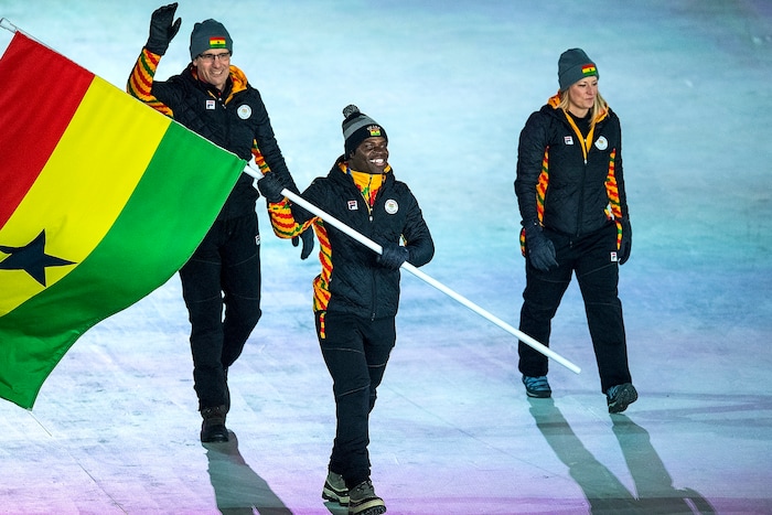 (Chris Detrick | The Salt Lake Tribune) Former Utah Valley University sprinter Akwasi Frimpong carries the flag of Ghana during the Pyeongchang 2018 Winter Olympics opening ceremony at Olympic Stadium Friday, February 9, 2018.