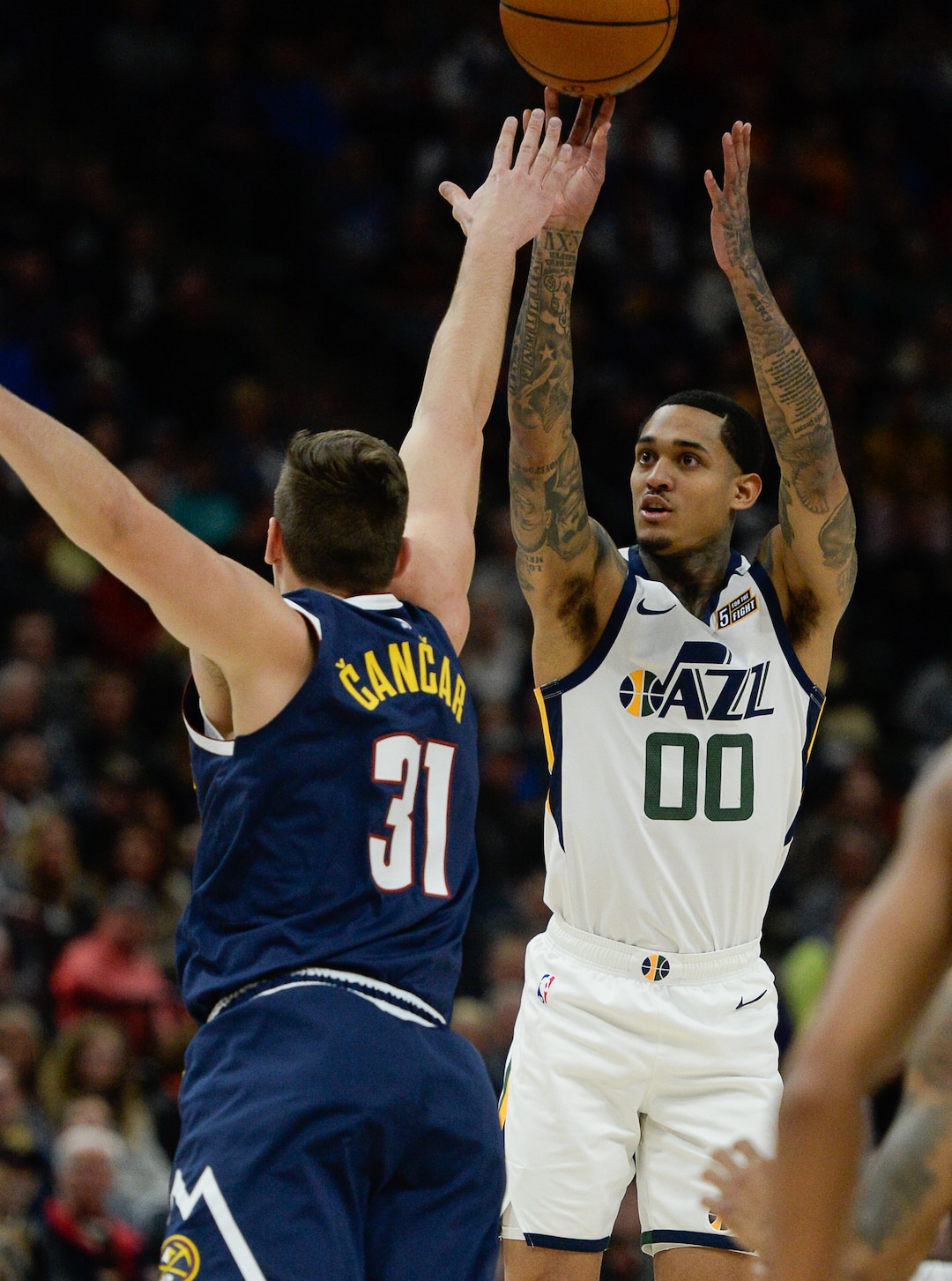 (Francisco Kjolseth  |  The Salt Lake Tribune) Denver Nuggets forward Vlatko Cancar (31) pressures Utah Jazz guard Jordan Clarkson (00) as the Utah Jazz host the Denver Nuggets in their NBA basketball game at Vivint Smart Home Arena in Salt Lake City on Wednesday, Feb. 5, 2020.