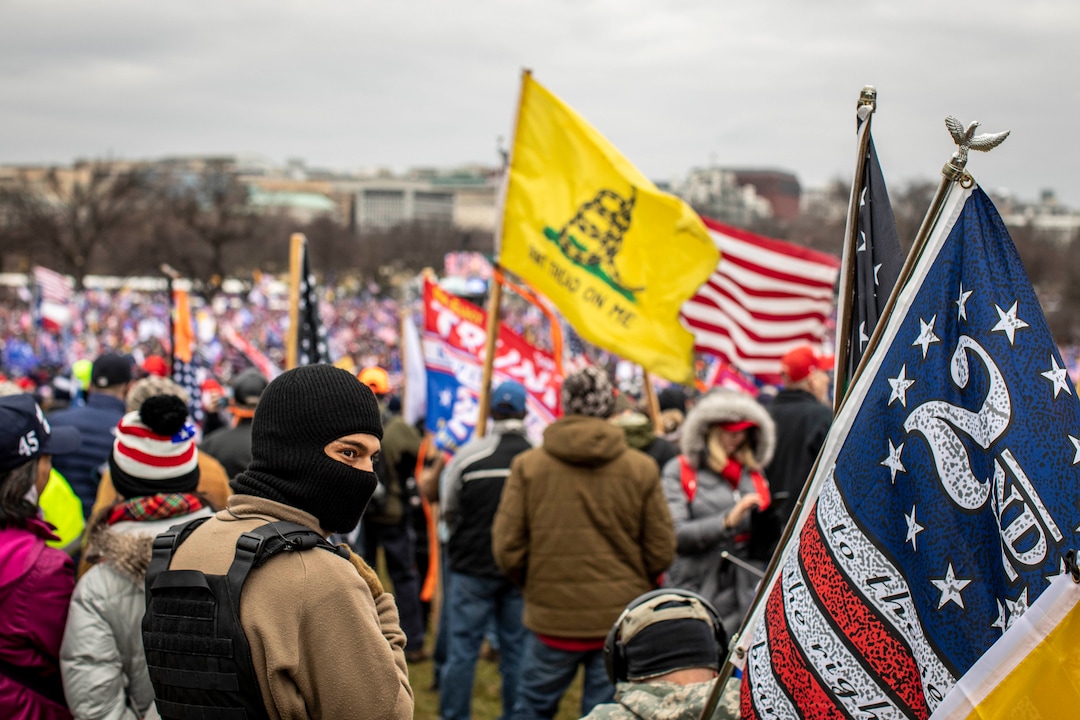 (Jason Andrew | The New York Times) Protestors converge onto the National Mall near the Washington Monument in Washington on Wednesday, Jan. 6, 2021, to protest the presidential election results. President Donald Trump addressed the protesters.
