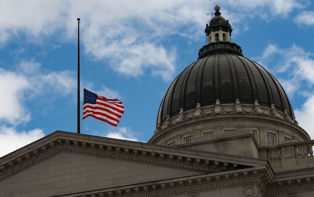 (Francisco Kjolseth | The Salt Lake Tribune) In coordination with a proclamation from President Biden, Gov. Spencer Cox orders the lowering of the flag as it flies at half-staff on Tuesday, Feb. 23, 2021 at the Utah Capitol in memory of the grim milestone reached of 500,000 American lives lost to COVID-19.