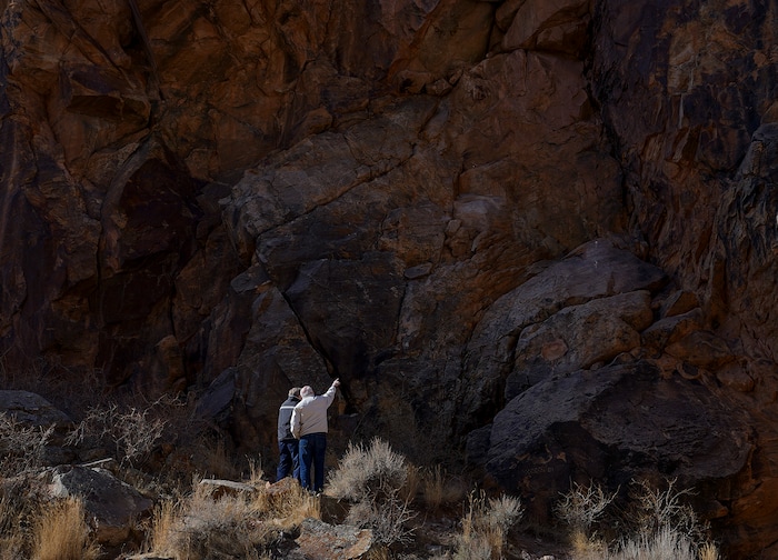 (Leah Hogsten | The Salt Lake Tribune) Morris Smith, left, of Lancaster, CA and Chris Chipping, right, of Levan discuss petroglyphs at Parowan Gap, March 20, 2021. Smith and Chipping, best friends since age 13 when they were neighbors in Salt Lake City, take trips to visit each other and their wives every chance they get.