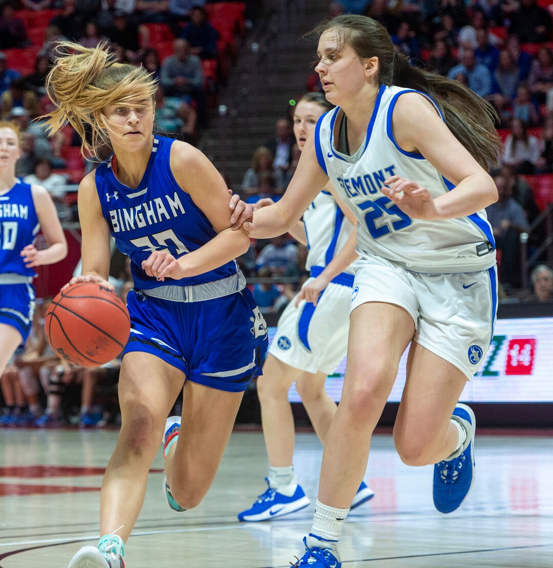 (Rick Egan  |  The Salt Lake Tribune)   Bingham Miners Sierra Lichtie (20) gets past Fremont Sliverwolves Emma Calvert 25, in the 6A championship game, between the Fremont Sliverwolves and the Bingham Miners, at the Jon M. Huntsman Center, Saturday Feb. 29, 2020
