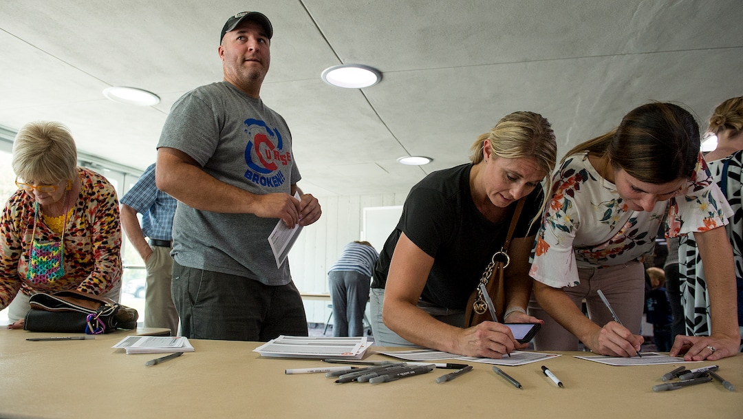 (Leah Hogsten  |  The Salt Lake Tribune) Garrett Pierson  filled out a reunification form to be able to pick up his daughter Grace, a 4th grader at Uintah Elementary School at the Dee Events Center on the Weber State University campus in Ogden. Evacuees were given food and water as residents waited to hear if they could return to their homes. The Uintah Fire is still burning through the town of Uintah and pockets of South Weber, as well as the unincorporated subdivision of Uintah Highlands.