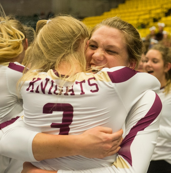 (Rick Egan  |  The Salt Lake Tribune)   Lone Peak Knights  Gabriella Haws (3) hugs Jacquelyn Langhaim (11) as the Knights celebrate their win over the Pleasant Grove Vikings, for the 6A volleyball championship, at Utah Valley University, Saturday, November 4, 2017.