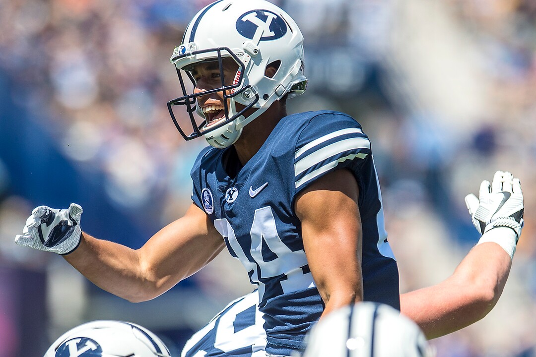 (Chris Detrick  |  The Salt Lake Tribune) Brigham Young Cougars wide receiver Neil Pau'u (84) celebrates his touchdown with Brigham Young Cougars offensive lineman Thomas Shoaf (59) during the game at LaVell Edwards Stadium Saturday, August 26, 2017.