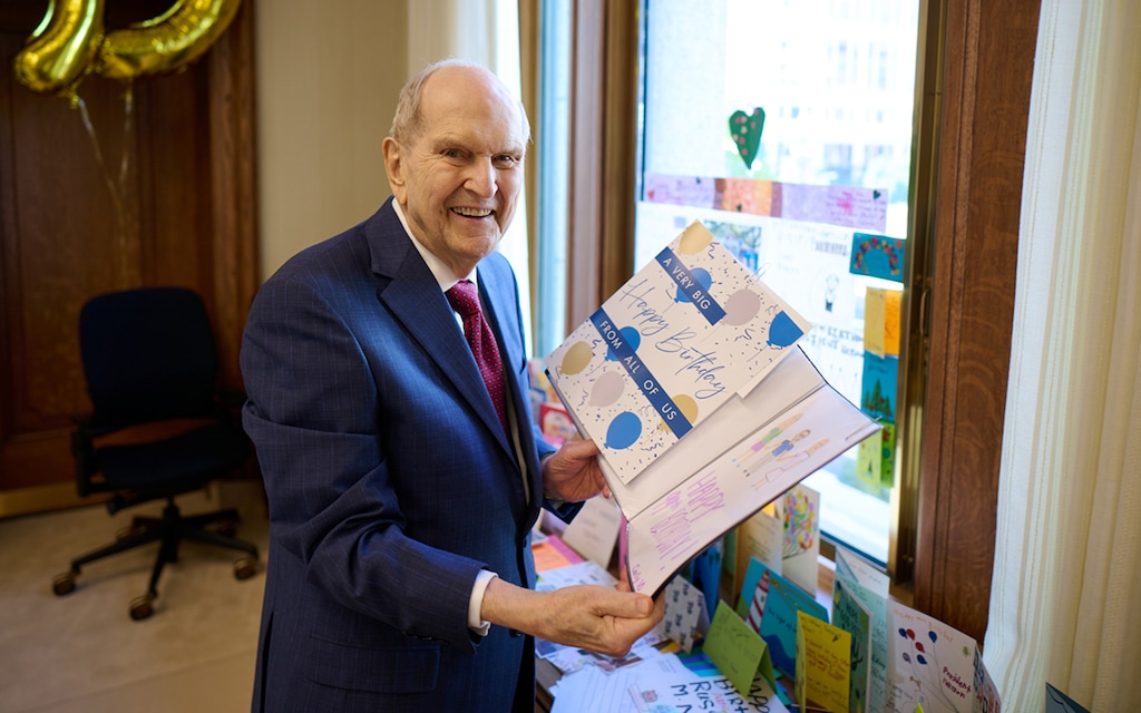 (The Church of Jesus Christ of Latter-day Saints) President Russell M. Nelson of The Church of Jesus Christ of Latter-day Saints looks at birthday cards sent to him for his 99th birthday in his office at the Church Administration Building in Salt Lake City on Friday, Sept. 8, 2023. He will turn 100 on Sept. 9, 2024.