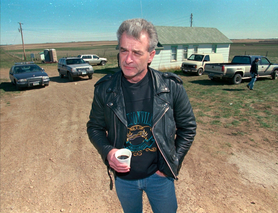 (Jim Mone via AP)
Randy Weaver, the object of the Ruby Ridge siege, visits with the media at the main FBI roadblock outside the Freemen compound in Montana on April 27, 1996.