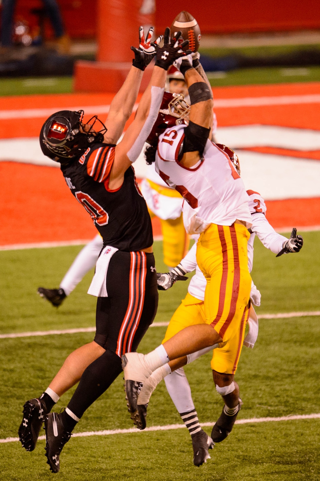 (Trent Nelson  |  The Salt Lake Tribune) USC Trojans safety Talanoa Hufanga (15) pulls in an interception ahead of Utah Utes tight end Brant Kuithe (80), as the Utah Utes host the USC Trojans, NCAA football at Rice-Eccles Stadium in Salt Lake City on Saturday, Nov. 21, 2020.