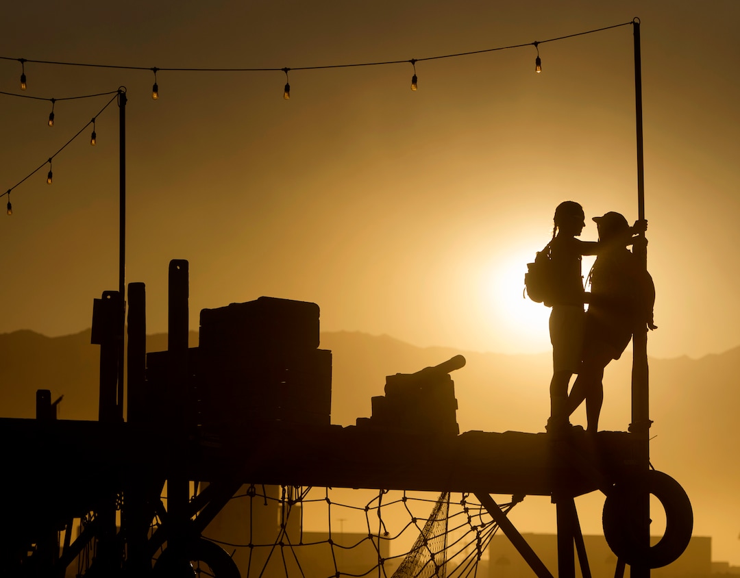 (Rick Egan  |  The Salt Lake Tribune)A couple hangs out on the Pier by Mathew Shultz, at sunset, during Burning Man, in the Black Rock Desert, north of Reno Nevada, Saturday, September 2, 2017.