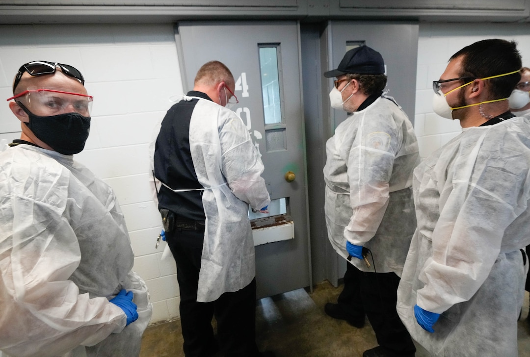 (Francisco Kjolseth | The Salt Lake Tribune) Prison staff work to safely move inmates from their cells into the common day room to be vaccinated against COVID-19 during a vaccination event with interested incoming inmates at the Utah State Prison in Draper on Tuesday, July 27, 2021.