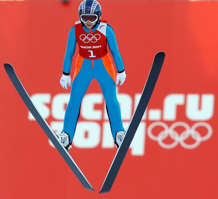 Sarah Hendrickson of the United States soars through the air during a women's ski jumping training session at the 2014 Winter Olympics, Saturday, Feb. 8, 2014, in Krasnaya Polyana, Russia. (AP Photo/Matthias Schrader)