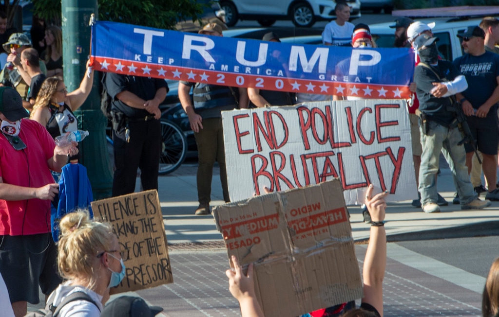 (Rick Egan  |  Tribune file photo)   Protesters from both sides face off Center Street, during a demonstration on Center Street in Provo, Wednesday July 1, 2020.