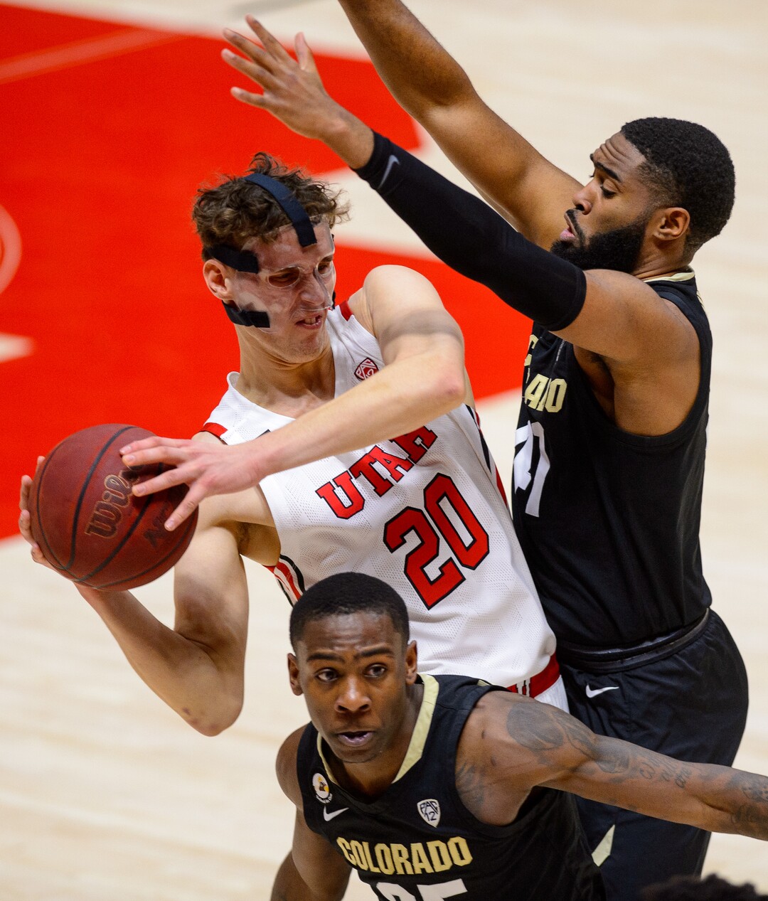 (Trent Nelson  |  The Salt Lake Tribune) Utah Utes forward Mikael Jantunen (20) defended by Colorado Buffaloes forward Jeriah Horne (41) as Utah hosts Colorado, NCAA basketball in Salt Lake City on Monday, Jan. 11, 2021.
