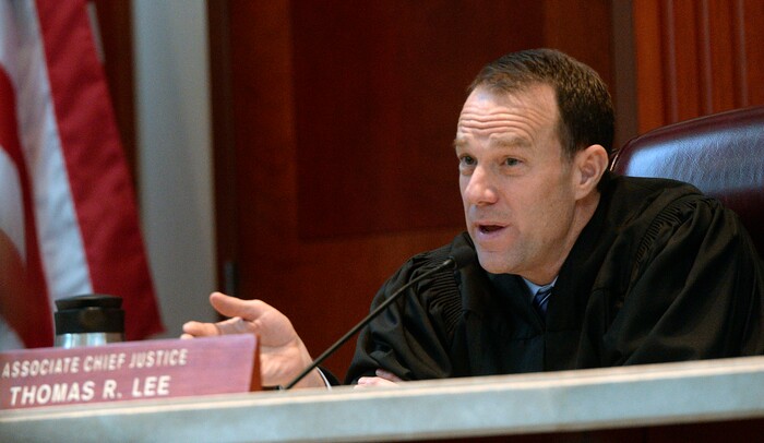 (Al Hartmann  |  The Salt Lake Tribune) 	
Utah Supreme Court Associate Chief Justice Thomas Lee questions federal public defender Charlotte Merrill, at the Utah Supreme Court Wednesday Jan. 10. The court heard arguments regarding Anthony Michael Archuleta, 55, who has been on death row since his conviction in 1989 for the Nov. 21, 1988, torture slaying of Gordon Ray Church, a 28-year-old Southern Utah State College theater student, at a remote location in Millard County. In separate trials, Archuleta and co-defendant Lance Conway Wood each were convicted of capital murder. Wood was sentenced to life in prison. Archuleta was sentenced to death. 