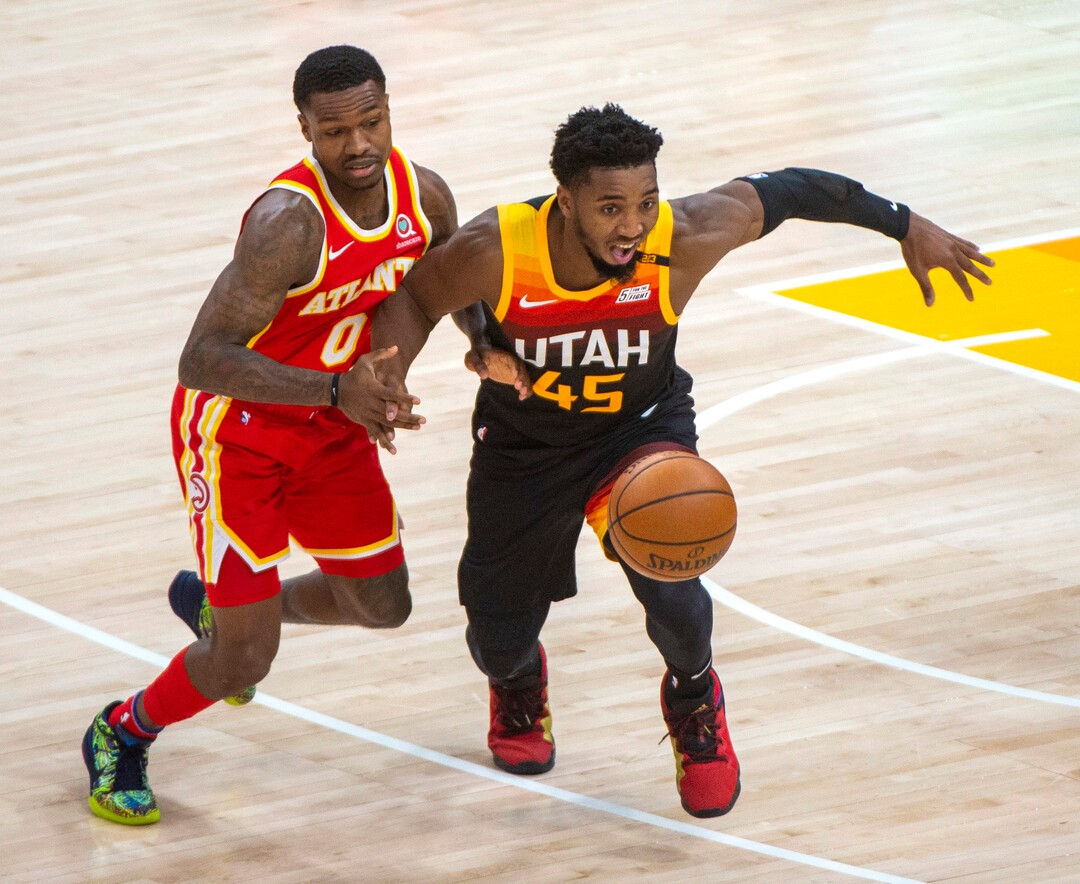 (Rick Egan | The Salt Lake Tribune) Utah Jazz guard Donovan Mitchell (45) knocks the ball out of the hands of Atlanta Hawks guard Brandon Goodwin (0), in NBA action between the Utah Jazz and the Atlanta Hawks at Vivint Arena, on Friday, Jan. 15, 2021.