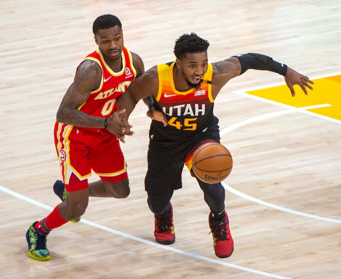 (Rick Egan | The Salt Lake Tribune) Utah Jazz guard Donovan Mitchell (45) knocks the ball out of the hands of Atlanta Hawks guard Brandon Goodwin (0), in NBA action between the Utah Jazz and the Atlanta Hawks at Vivint Arena, on Friday, Jan. 15, 2021.