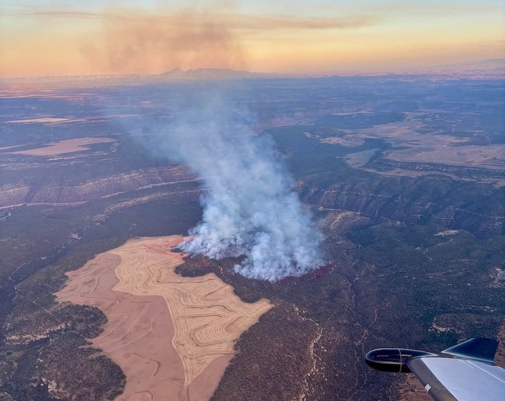(Utah Fire Info) An aerial view shows the lightning-caused Dodge Fire, which grew to an estimated 30 to 40 acres and threatened structures about 10 miles southeast of Monticello on Monday.