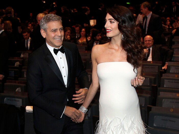 FILE - In this Feb. 24, 2017 file photo, actor George Clooney, left, and Amal Clooney arrive at the 42nd Cesar Film Awards ceremony at Salle Pleyel in Paris. George and Amal Clooney have welcomed twins Ella and Alexander Clooney. The pair was born Tuesday morning, June 6, 2017, according to George Clooney’s publicist Stan Rosenfield. (AP Photo/Thibault Camus, File)