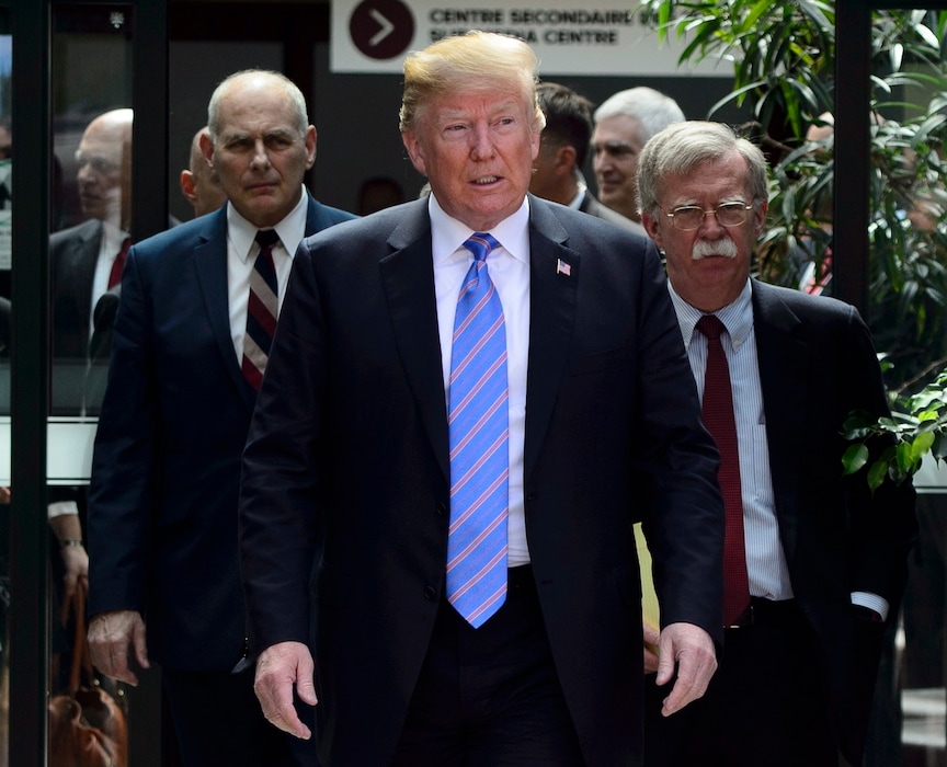 U.S. President Donald Trump leaves the G7 Leaders Summit in La Malbaie, Que., on Saturday, June 9, 2018., with White House Chief of Staff John Kelly, left, and National Security Adviser John Bolton. (Sean Kilpatrick/The Canadian Press via AP)