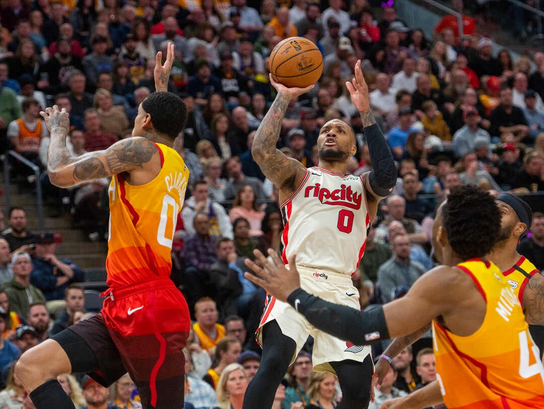 (Rick Egan  |  The Salt Lake Tribune)     Trail Blazers guard Damian Lillard (0) scores for Portland, in the Jazz 117-114 win over the Portland Trail Blazers, in NBA action in Salt Lake City, Friday, Feb. 7, 2020.