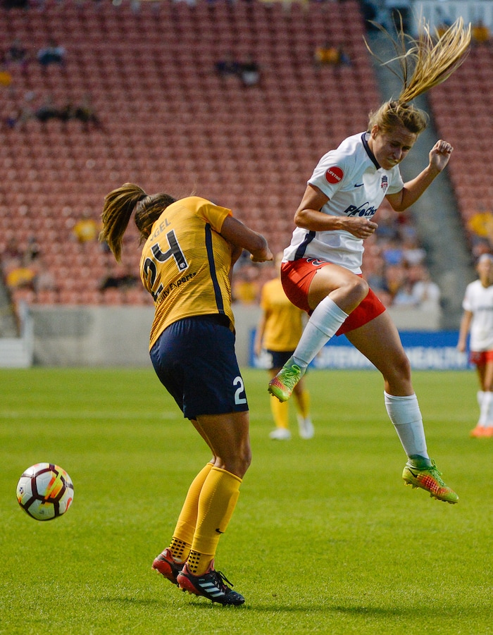(Francisco Kjolseth  |  The Salt Lake Tribune)  Utah Royals FC hosts Washington Spirit, NWSL soccer at Rio Tinto Stadium in Sandy, Wed. Aug. 8, 2018. Utah Royals FC forward Katie Stengel (24) collides with Washington Spirit forward Mallory Eubanks (22) following a header attempt in the first half of the game. 