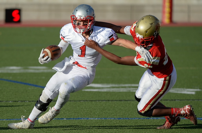 (Francisco Kjolseth  |  The Salt Lake Tribune)  Isaac Butler of Manti is pressured by Treyvon Sidberry of Judge in the Class 3A football playoff game at Judge Memorial on Thursday, Oct. 19, 2017. 