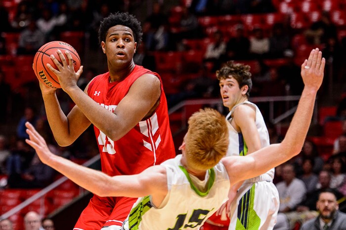 (Trent Nelson | The Salt Lake Tribune)  East vs. Timpanogos, 5A State high school basketball tournament at the Huntsman Center in Salt Lake City, Wednesday Feb. 28, 2018. Timpanogos's Tyler Walker (15) falls in front of East's Mikey Frazier (45).