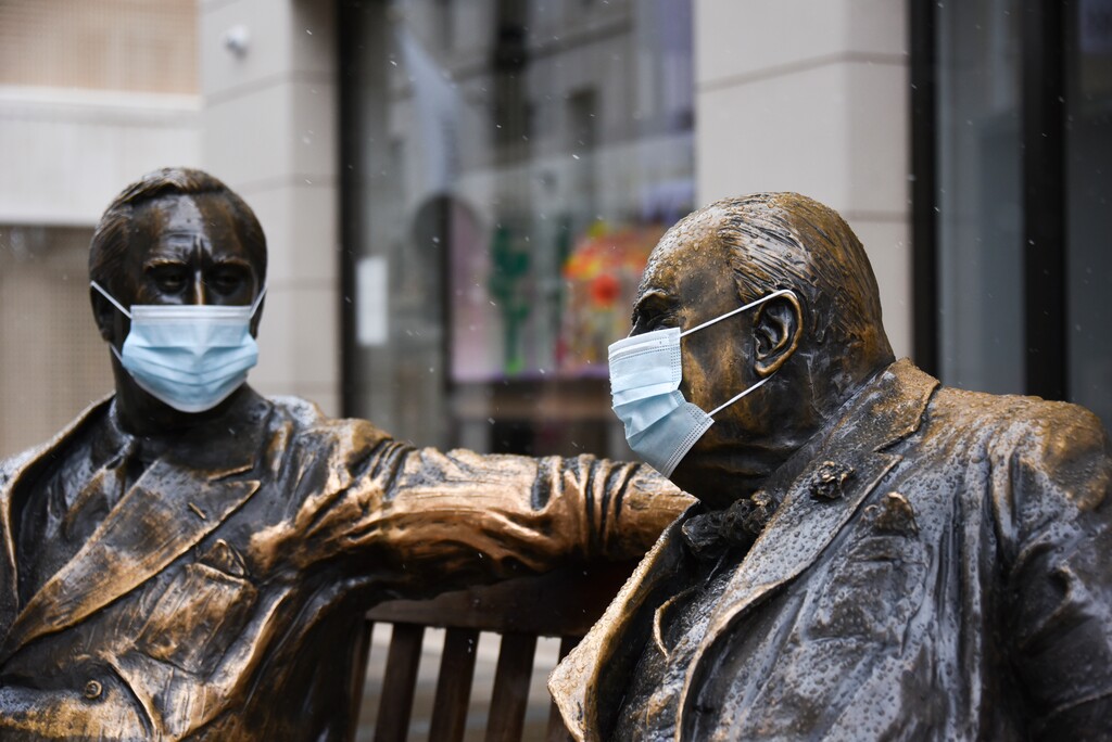 Face coverings on the statues of former US President Franklyn D. Roosevelt, left, and former British Prime Minister Winston Churchill in Mayfair, London, Sunday, Feb. 7, 2021, as the third national lockdown, due to the COVID-19 outbreak, continues. (AP Photo/Alberto Pezzali)
