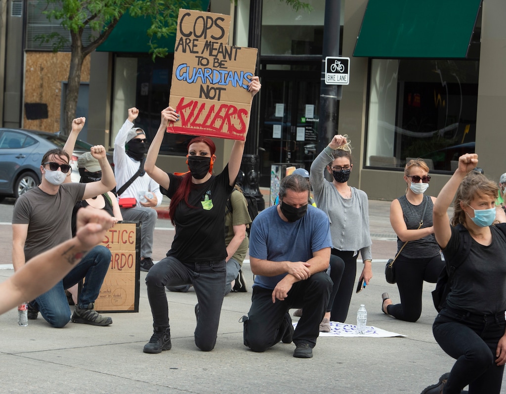 (Rick Egan  |  Tribune file photo)     Protesters stop and take a knee in remembrance of Bernardo  on Mains Street in Salt Lake City, during a Justice for Bernardo rally on Thursday, June 25, 2020.