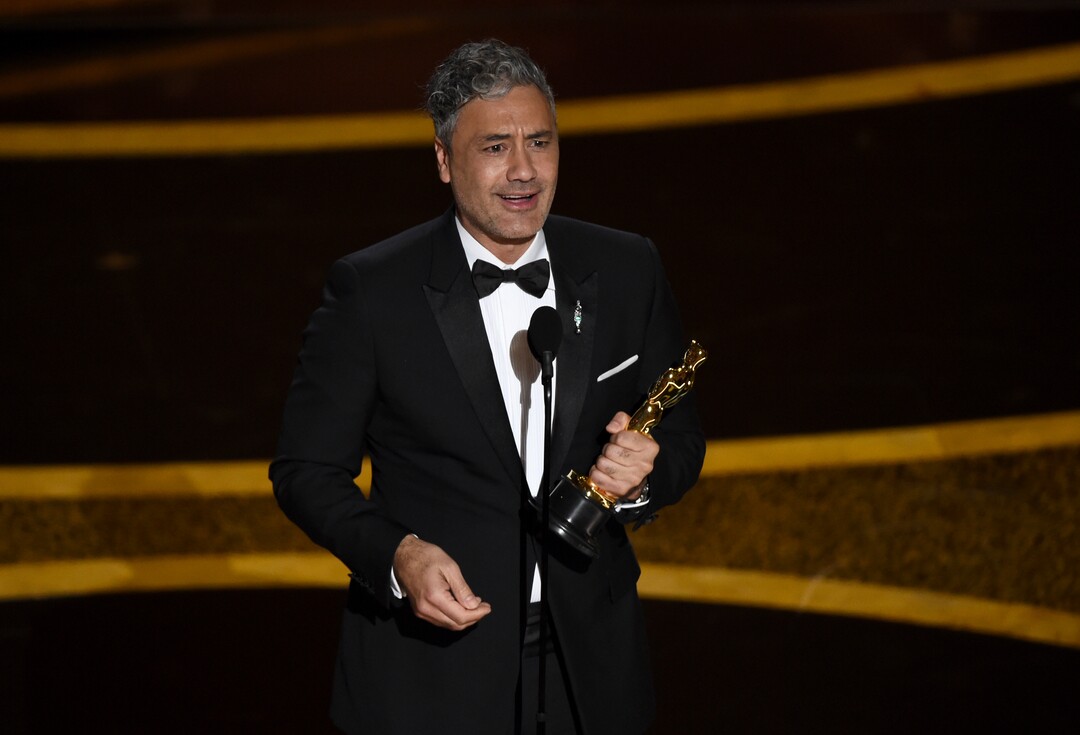 (Chris Pizzello | AP)  Taika Waititi accepts the award for best adapted screenplay for "Jojo Rabbit" at the Oscars on Sunday, Feb. 9, 2020, at the Dolby Theatre in Los Angeles.