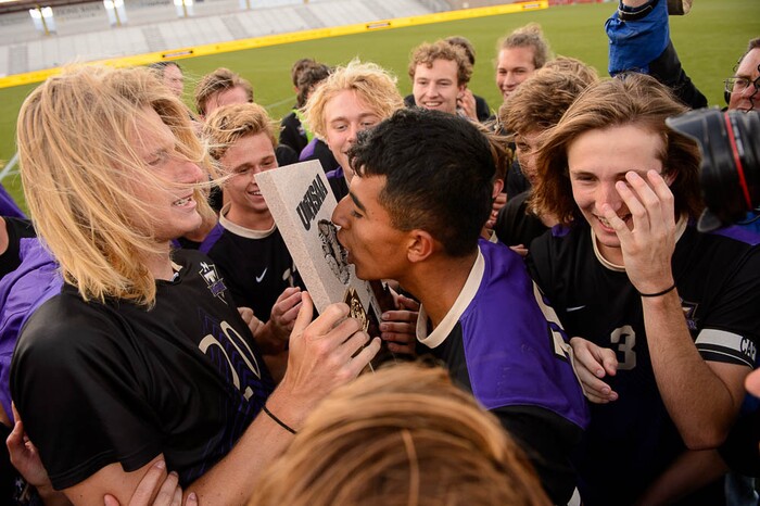 (Trent Nelson | The Salt Lake Tribune)  Desert Hills players celebrate their win over Park City High School in the 4A state championship game, Saturday May 12, 2018.