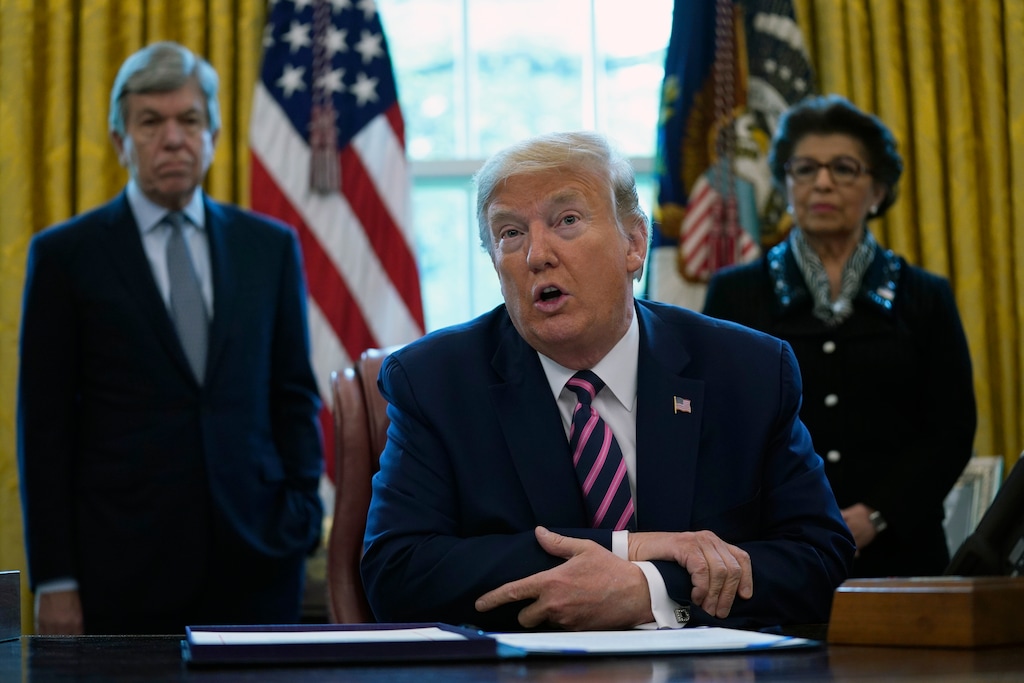(Evan Vucci | AP) President Donald Trump speaks before signing a coronavirus aid package to direct funds to small businesses, hospitals, and testing, in the Oval Office of the White House, Friday, April 24, 2020, in Washington. Sen. Roy Blunt, R-Mo., left, and Jovita Carranza, administrator of the Small Business Administration look on.