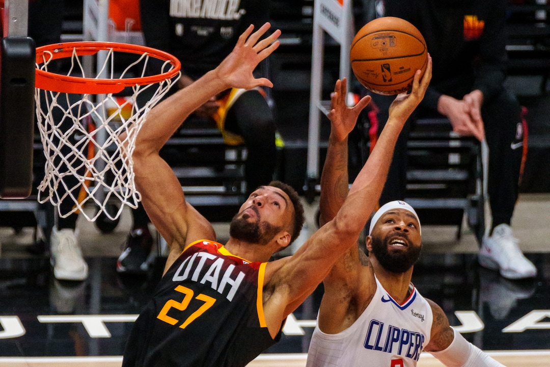 (Trent Nelson  |  The Salt Lake Tribune) Utah Jazz center Rudy Gobert (27) and LA Clippers forward Marcus Morris Sr. (8) reach for the ball as the Utah Jazz host the Los Angeles Clippers in a Game 5 matchup, NBA basketball in Salt Lake City on Wednesday, June 16, 2021.