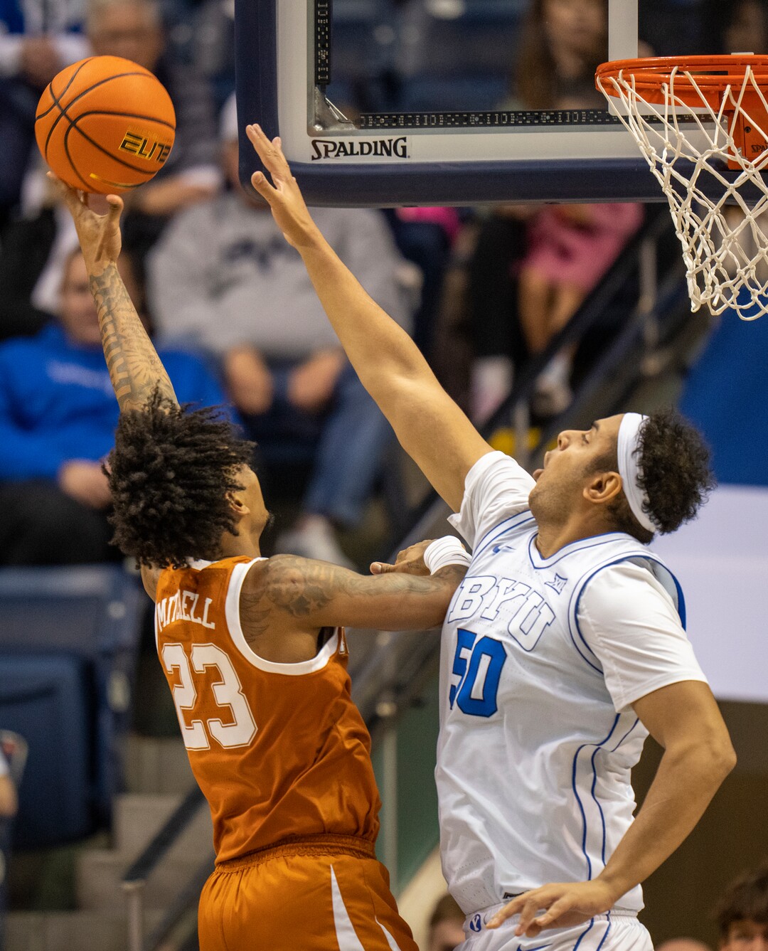 (Rick Egan | The Salt Lake Tribune) Texas Longhorns forward Dillon Mitchell (23) shoots over Brigham Young Cougars center Aly Khalifa (50)  in basketball action between the Brigham Young Cougars and the Texas Longhorns, at the Marriott Center, on Saturday, Jan. 27, 2024.
