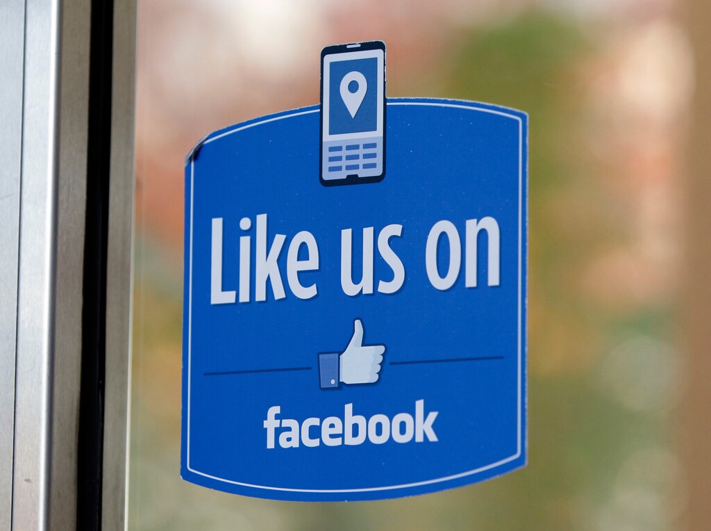 FILE - In this Dec. 13, 2011 file photo, a sign with Facebook's "Like" logo is posted at Facebook headquarters near the office for the company's User Operations Safety Team in Menlo Park, Calif.