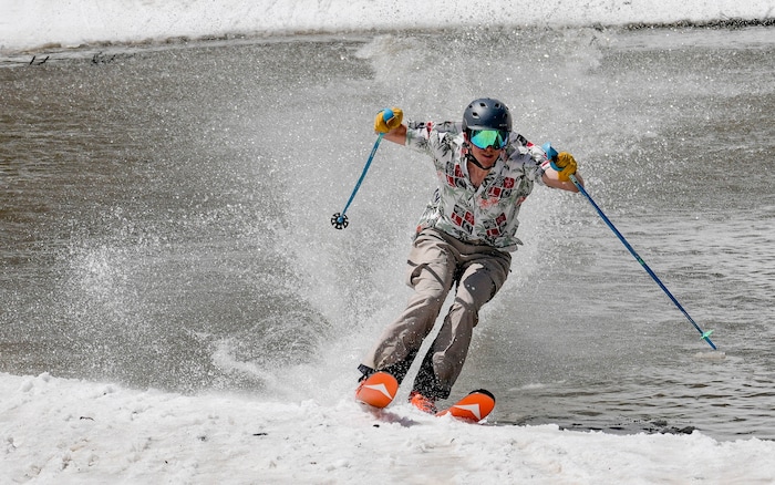 (Francisco Kjolseth  | The Salt Lake Tribune) A skier skims the pond in Peruvian Gulch as Snowbird closes the book on the 2024-25 ski season on Monday, May 26, 2025. Snow and sun revelers took to the slushy slopes on Memorial Day as the resort was the last in the state to close.
