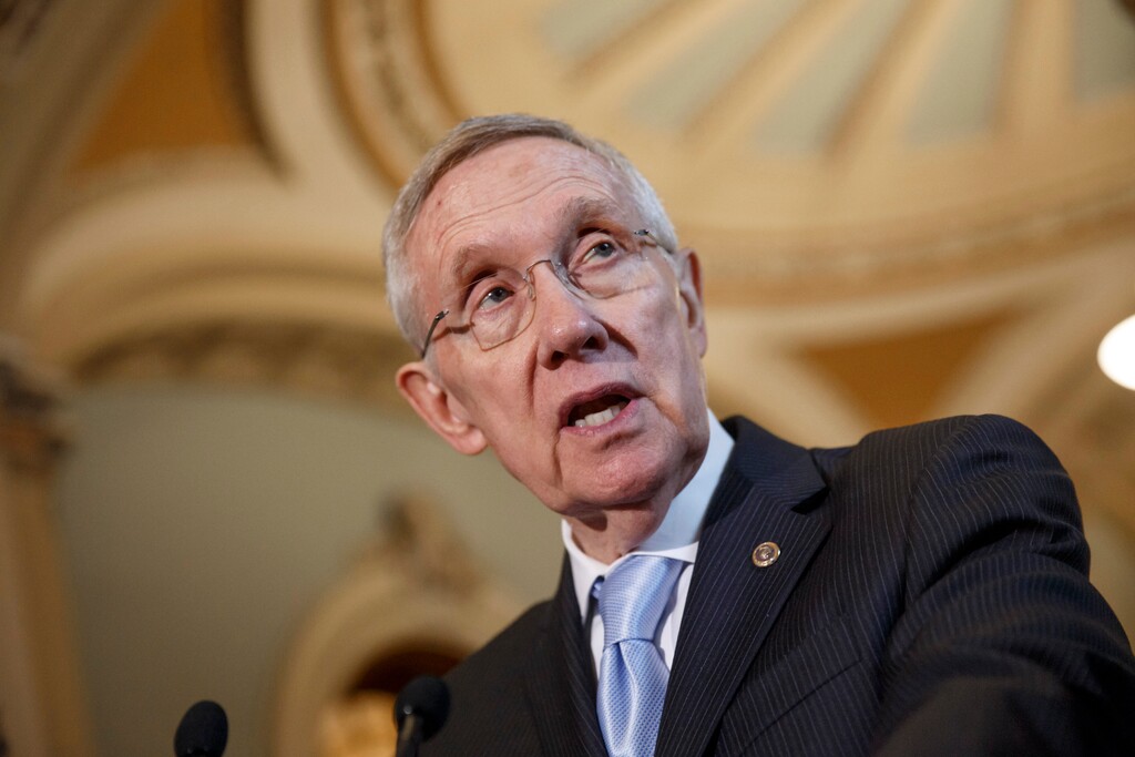 Senate Majority Leader Harry Reid, D-Nev., speaks with reporters following a Democratic policy lunch at the Capitol in Washington, Tuesday, Sept. 16, 2014. Reid is working to ensure that a nuclear waste dump in his home state of Nevada remains mothballed even though the government has spent $15 billion on it. Some Republicans are talking about trying to revive the Yucca Mountain nuclear waste dump if their party takes control of the Senate in November.  (AP Photo/J. Scott Applewhite)