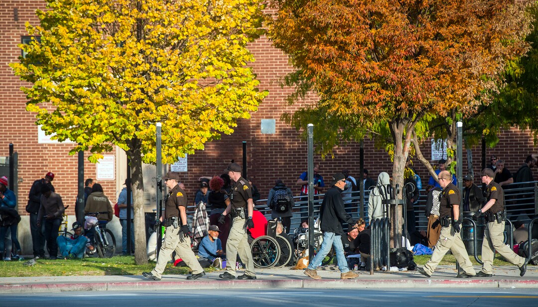(Chris Detrick  |  The Salt Lake Tribune)  Utah Highway Patrol members walk along 500 West near the Road Home in Salt Lake City Tuesday, October 17, 2017. 