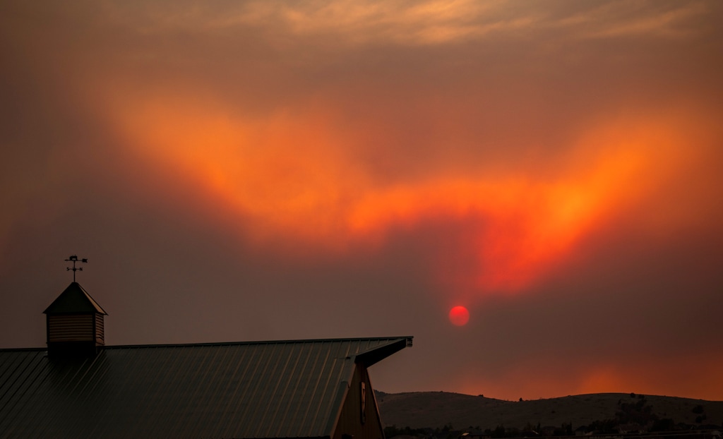 (Rick Egan | The Salt Lake Tribune) The sun is seen through the smoke in Juab County on Friday, June 26, 2026. The Iron and Cherry fires have now burned more than 70,000 acres combined, forcing multiple communities to flee.

