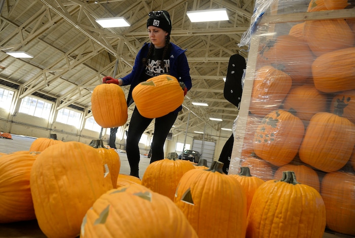(Al Hartmann  |  The Salt Lake Tribune) 	Chelsea Kasen, production manager-desginer unloads some of the thousands of pumpkins at Salt Lake City’s new event, Pumpkin Nights.  It's an outdoor, family-friendly Halloween walkthrough with ten immersive lands created with more than 3,000 hand-carved pumpkins. It will be open for 17 days—kicking off on Friday, Oct. 13 through Sunday, Oct. 29 at the Utah State Fairpark.